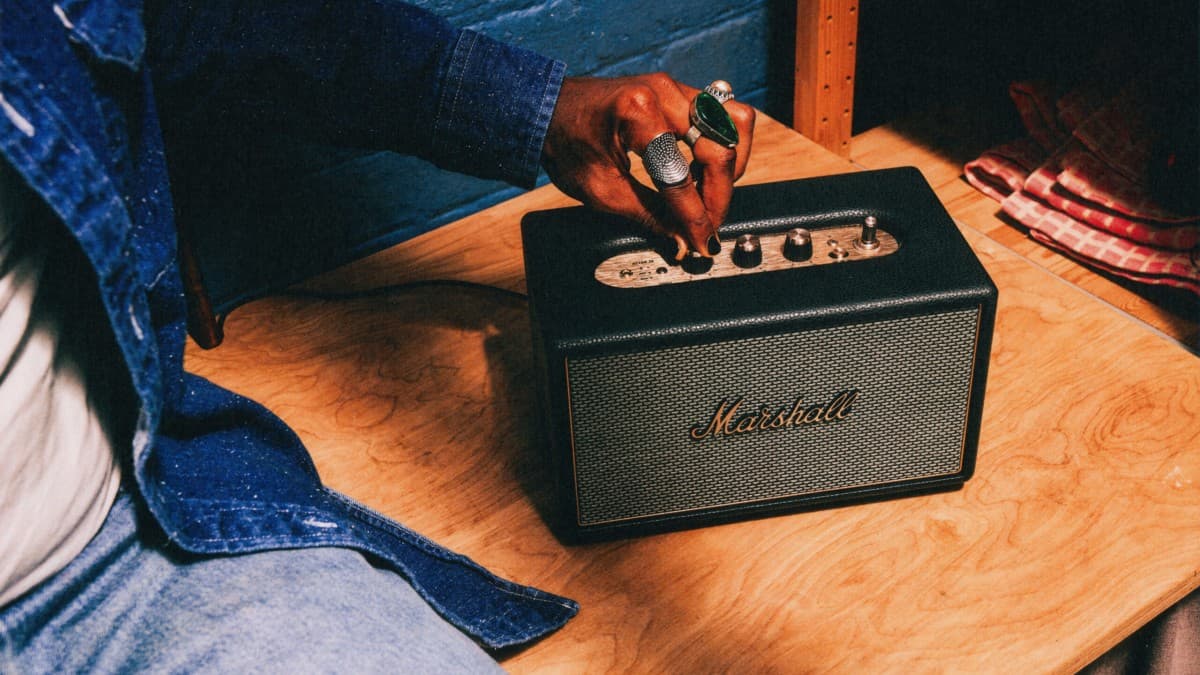 Marshall Acton IV home speaker with salt-and-pepper grille on a table